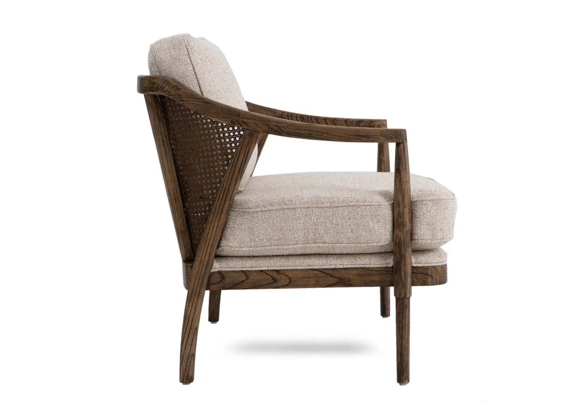 A beige fabric occasional chair from EZ Livings Roundstone range.Side view