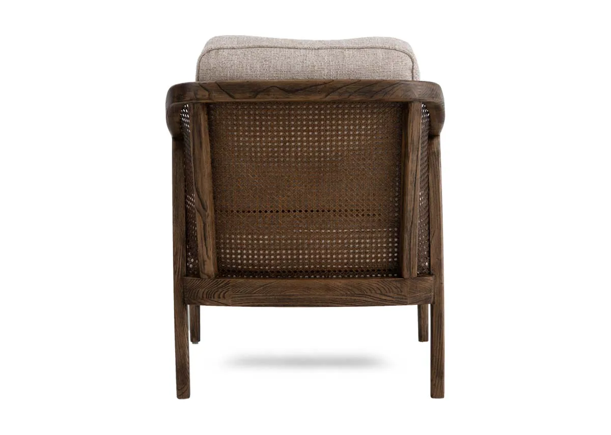 A beige fabric occasional chair from EZ Livings Roundstone range.Back view of rattan detail.