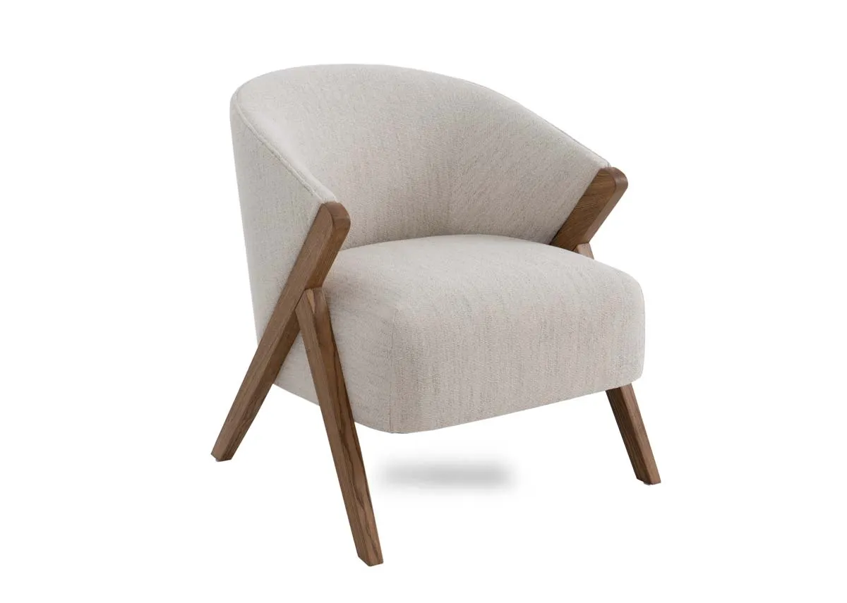 A cream fabric occasional chair from EZ Livings Toulon range. Angled view of thick cream padded seat and modest frame.