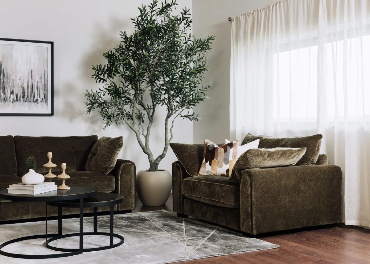 A lifestyle image of the Darcy Cuddler with Toko tables and Avery rug