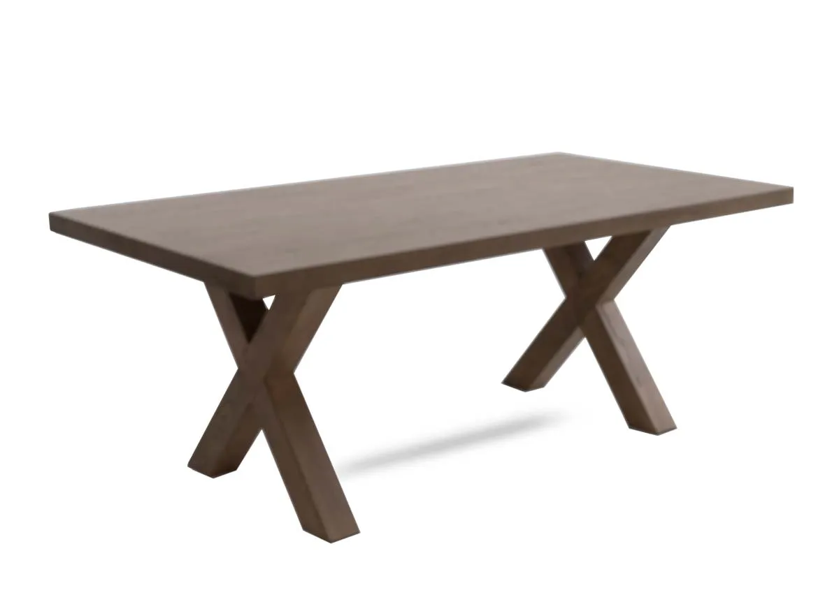 A grey brown ash wood dining table with x legs from EZ Livings Geneva range. Angled view of thick table top.