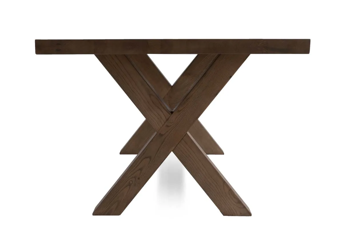 A grey brown ash wood dining table with x legs from EZ Livings Geneva range. Side view