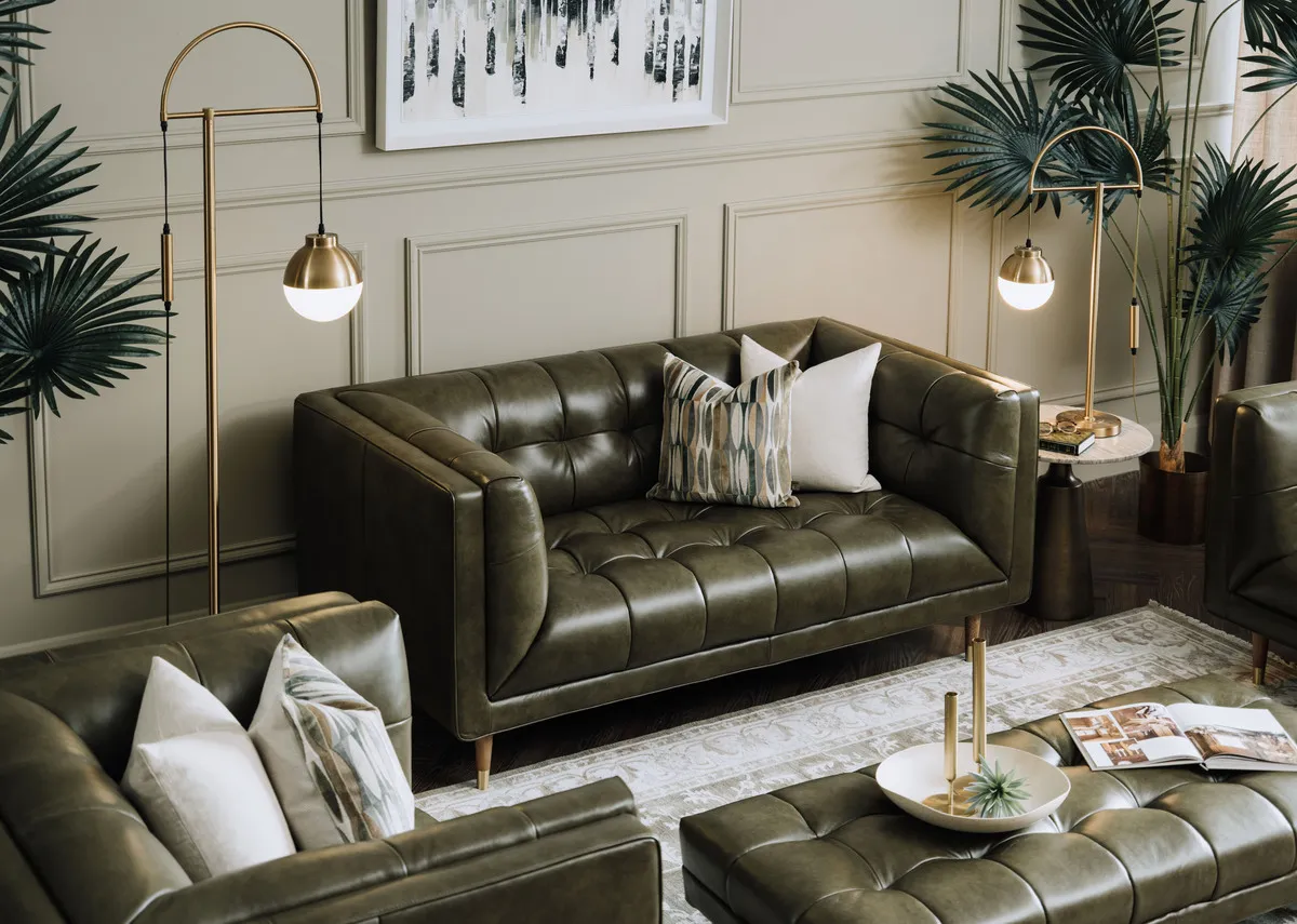 A lifestyle image of the Grace green leather sofa with pyramid side tabe and Casper lamps with Arden rug.