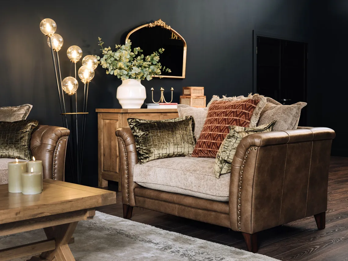 A lifestyle image of the Savannah cuddler with Ortez lamp