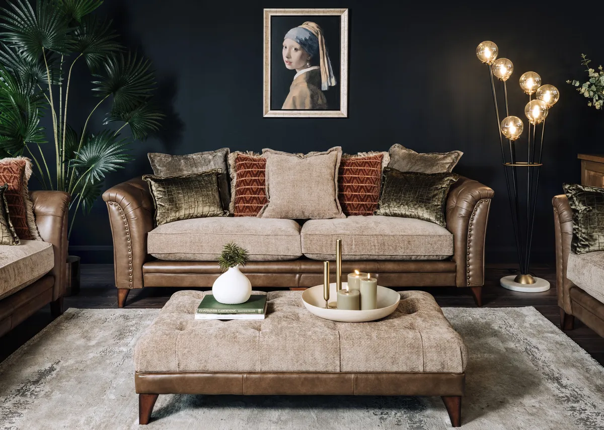 A lifestyle image of the Savannah footstool with matching sofa with Girl with a pearl earring picture.