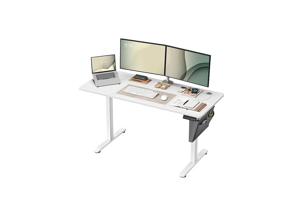 A white standing desk with wood top from EZ Livings Elevate range. Ciew of desk with 2 monitors and keyboard etc