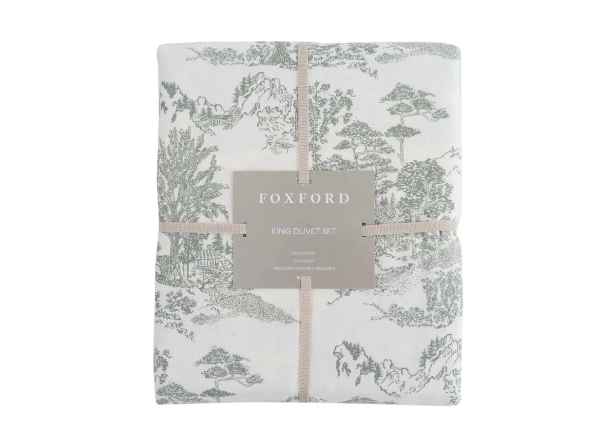 A front image of the Foxford Toile Duvet set in Foxford packaging with green floral and antique detailing on cream cotton.
