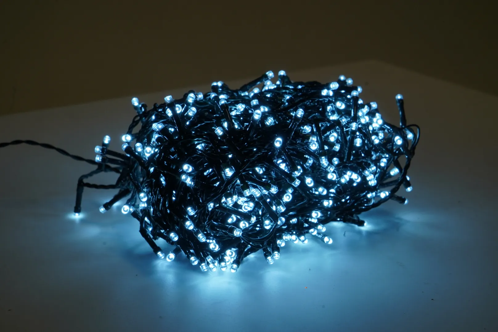 A lifestyle image of the EZ Living Furniture 2000 white tree decor lights switched on.