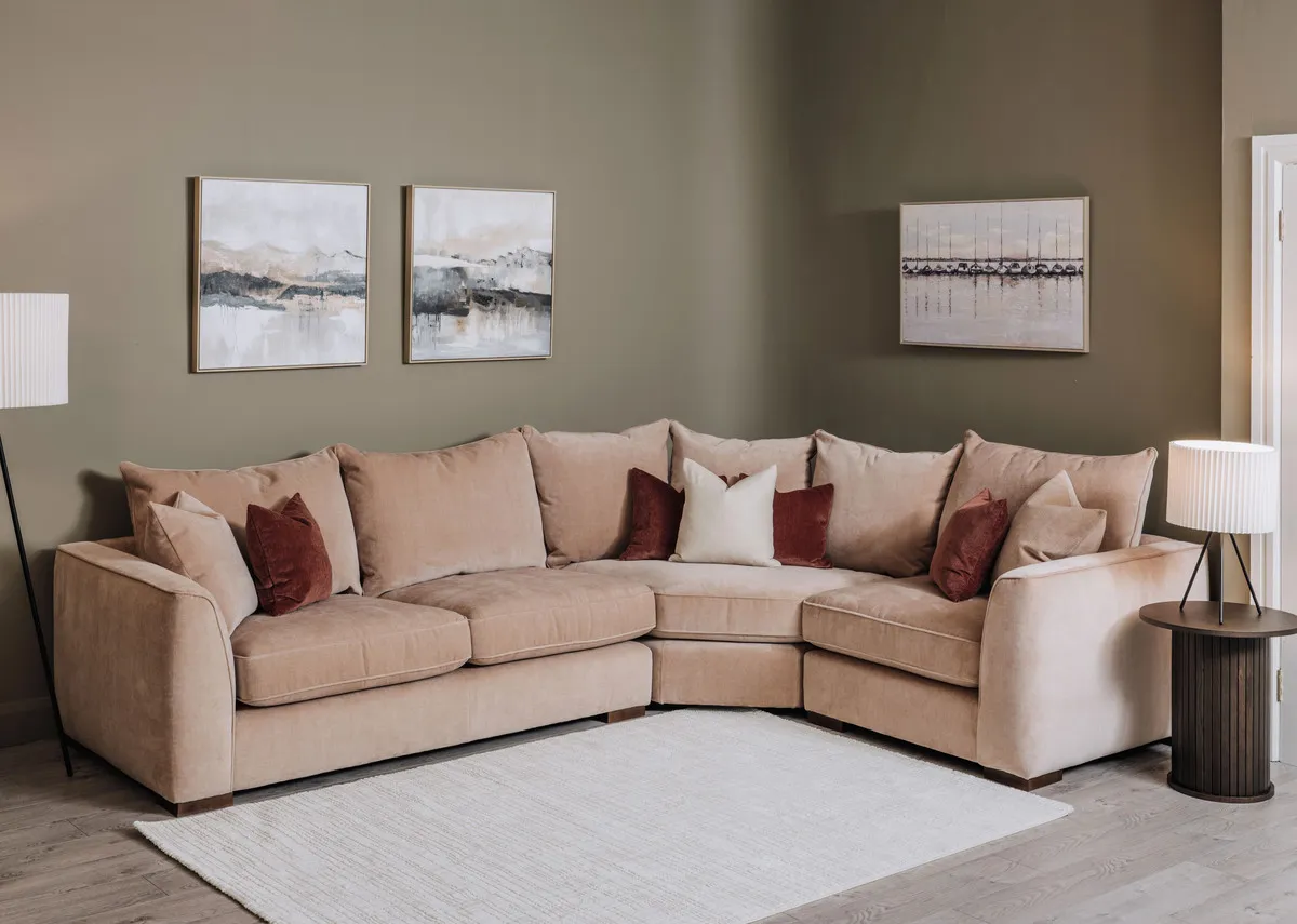 A lifestyle image of the Lucius corner sofa with Dawn at the marina picture