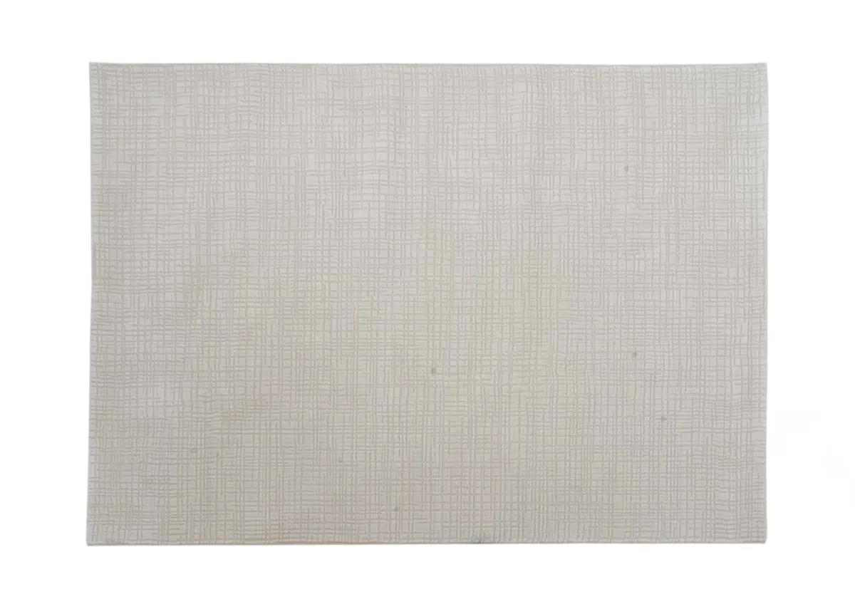 A large cream textured Sign rug with a closeup on the light munderlay.