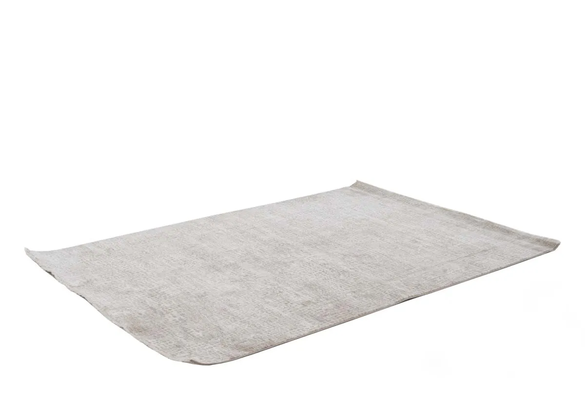 A beige and taupe distressed rug from EZ Livings Flowline range. Angled view show slim depth