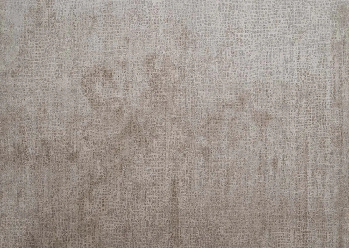 A beige and taupe distressed rug from EZ Livings Flowline range. Closeup of effect.