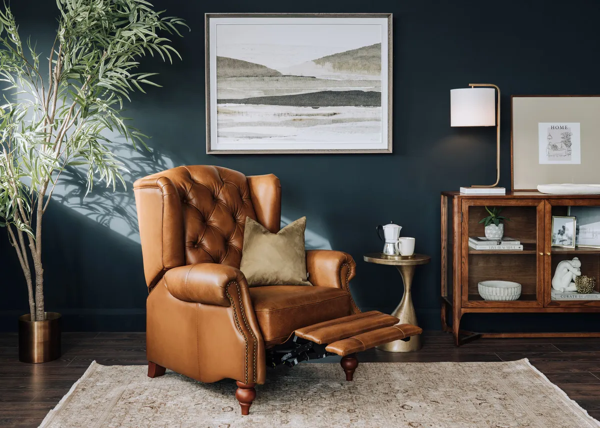 A lifetsyle image of the Adare chair reclined with Cameo sideboard and Arden rug. 