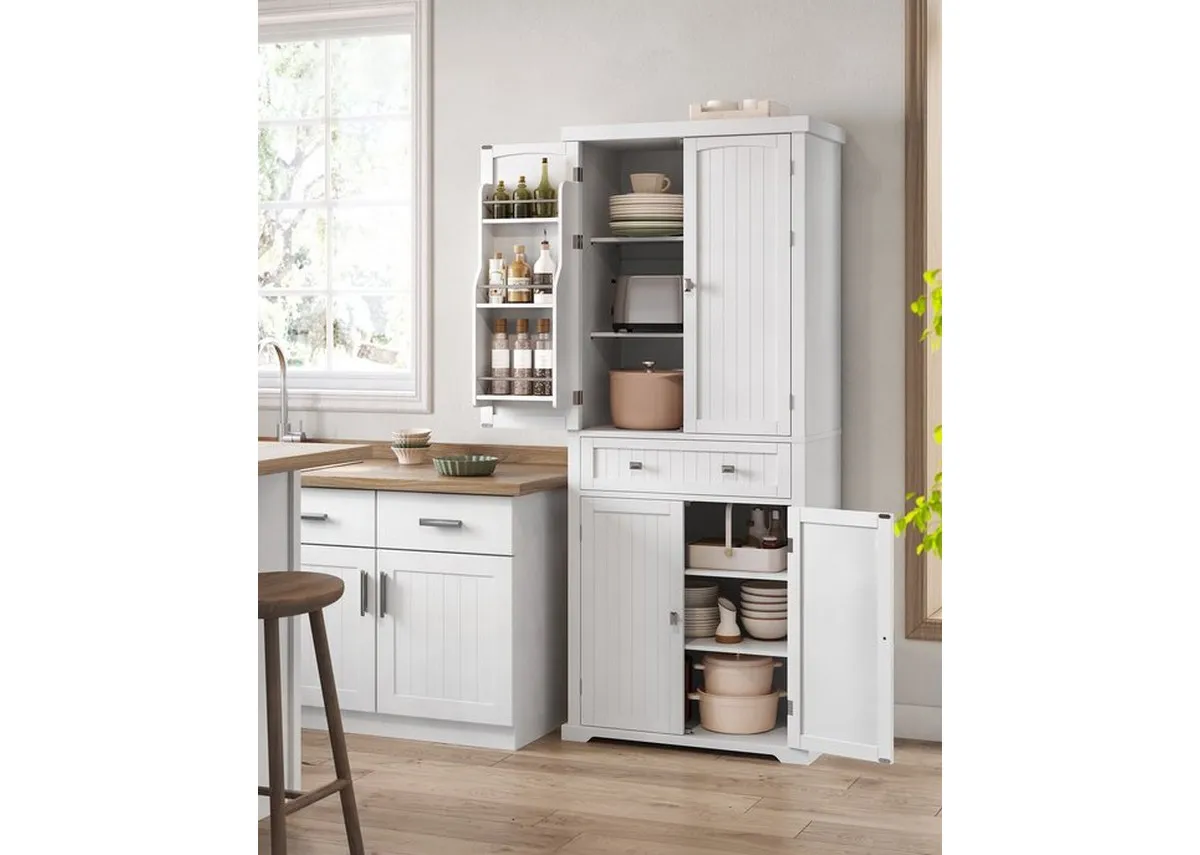 A lifestyle image of the Homestead cabinet in a kitchen setting with plates and dinnerware.