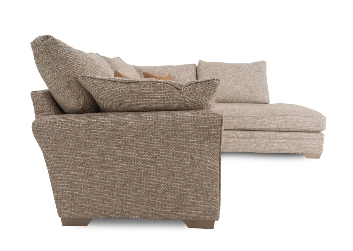 A beige fabric corner sofa with chaise on left from EZ Living Furnitures Strata range.Side view