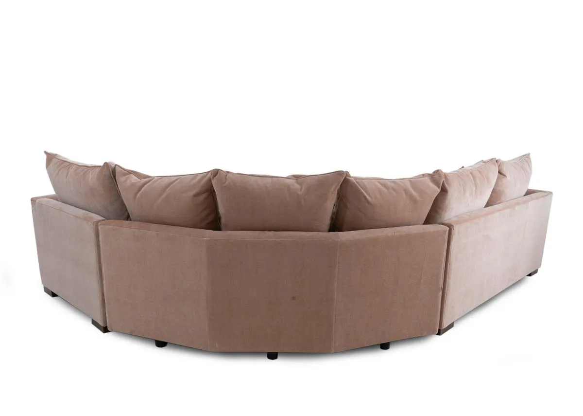 An LAF pink fabric corner sofa with rust cushions from Lucius range. Back view of warrantied frame