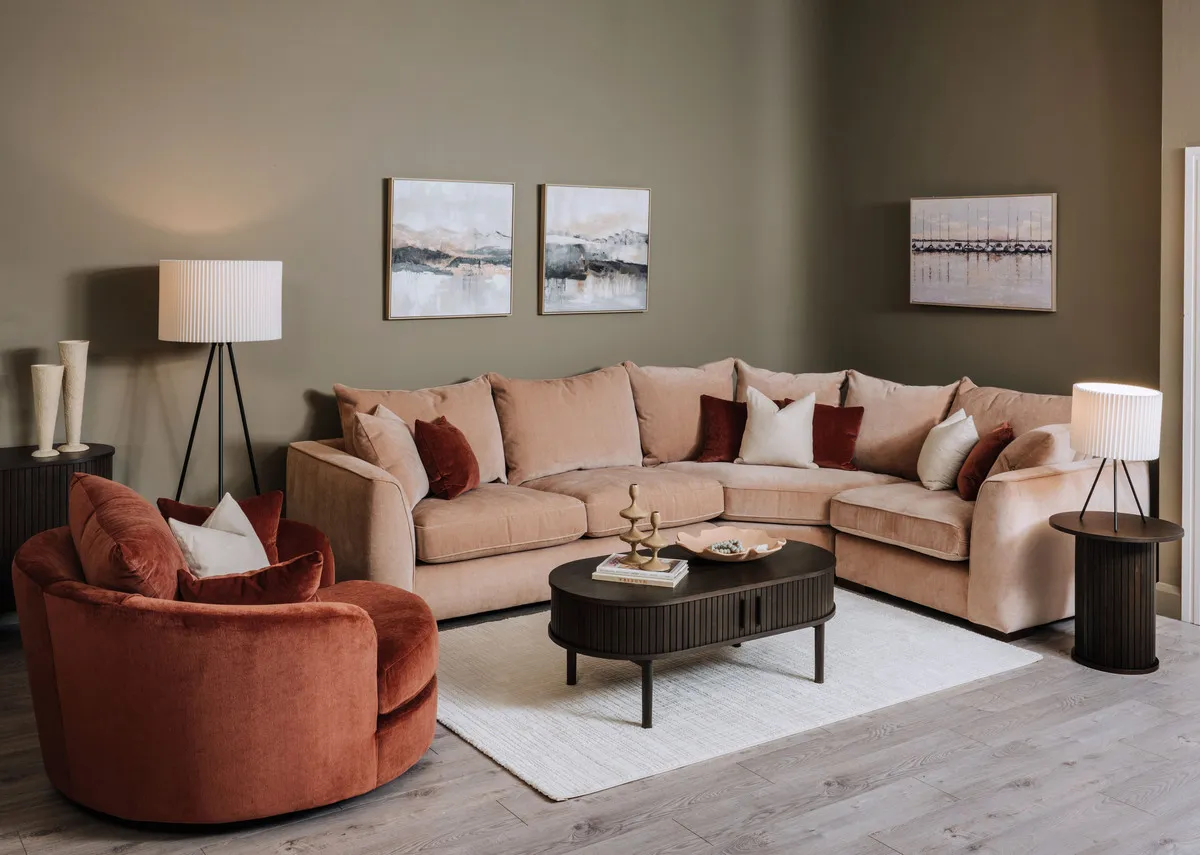 A lifetsyle image of the Lucius LAF corner sofa with swivel and nola espresso tables.