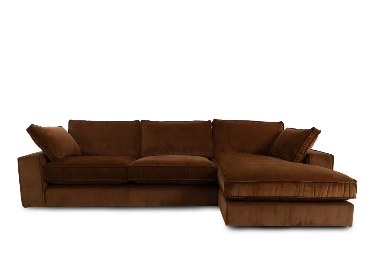 A bronze brown fabric  laf corner chaise from EZ Livings Addison range. Closeup of bronze velvet fabric