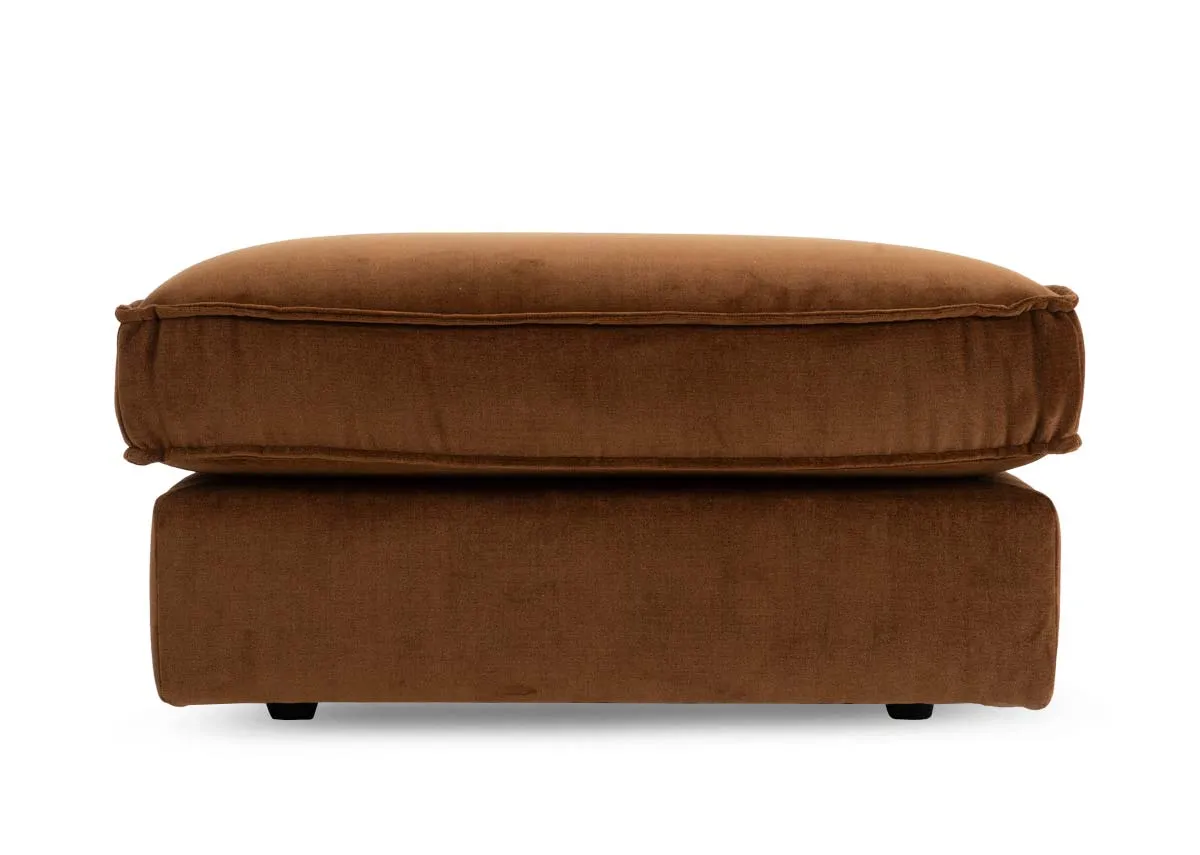 A bronze brown fabric footstool from EZ Livings Addison range. Front view  of dark feet.