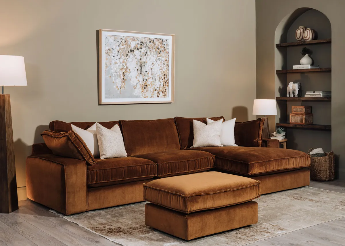 A lifestyle image of the Addison chaise with footstool and the Woodland warmth canvas with Drift rug