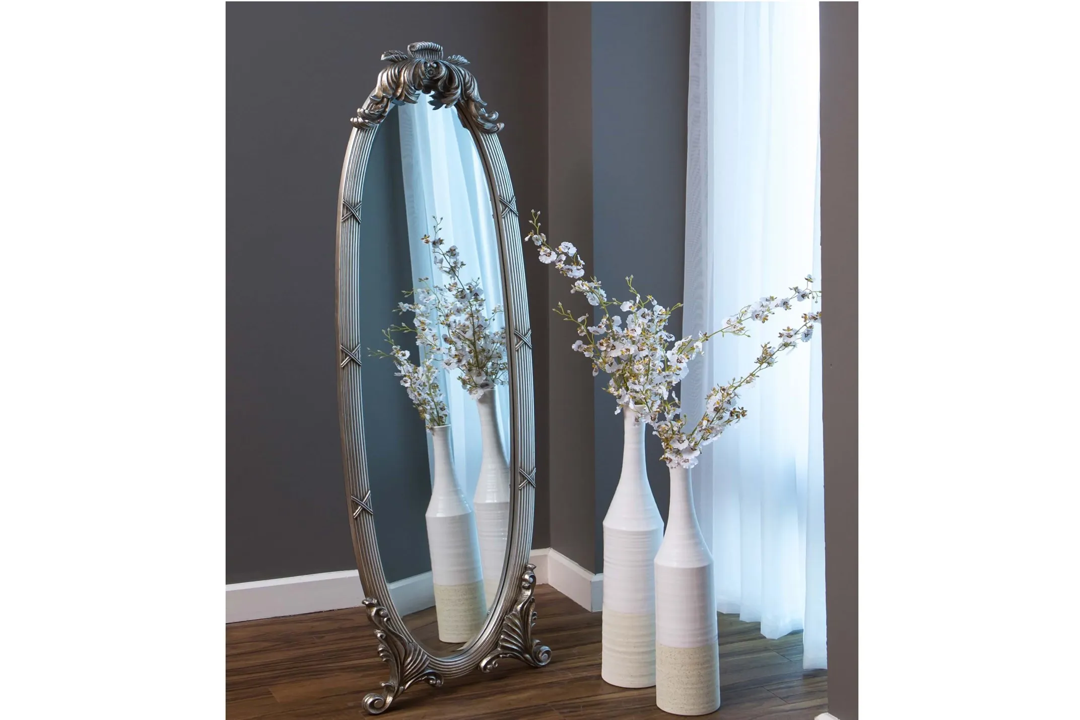 A lifestyle image of the antique styled Lana tall mirror