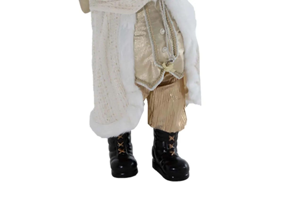 A white & gold Saint Nick figurine from EZ Livings Christmas range. Closeup of santas black boots and golod bloomers