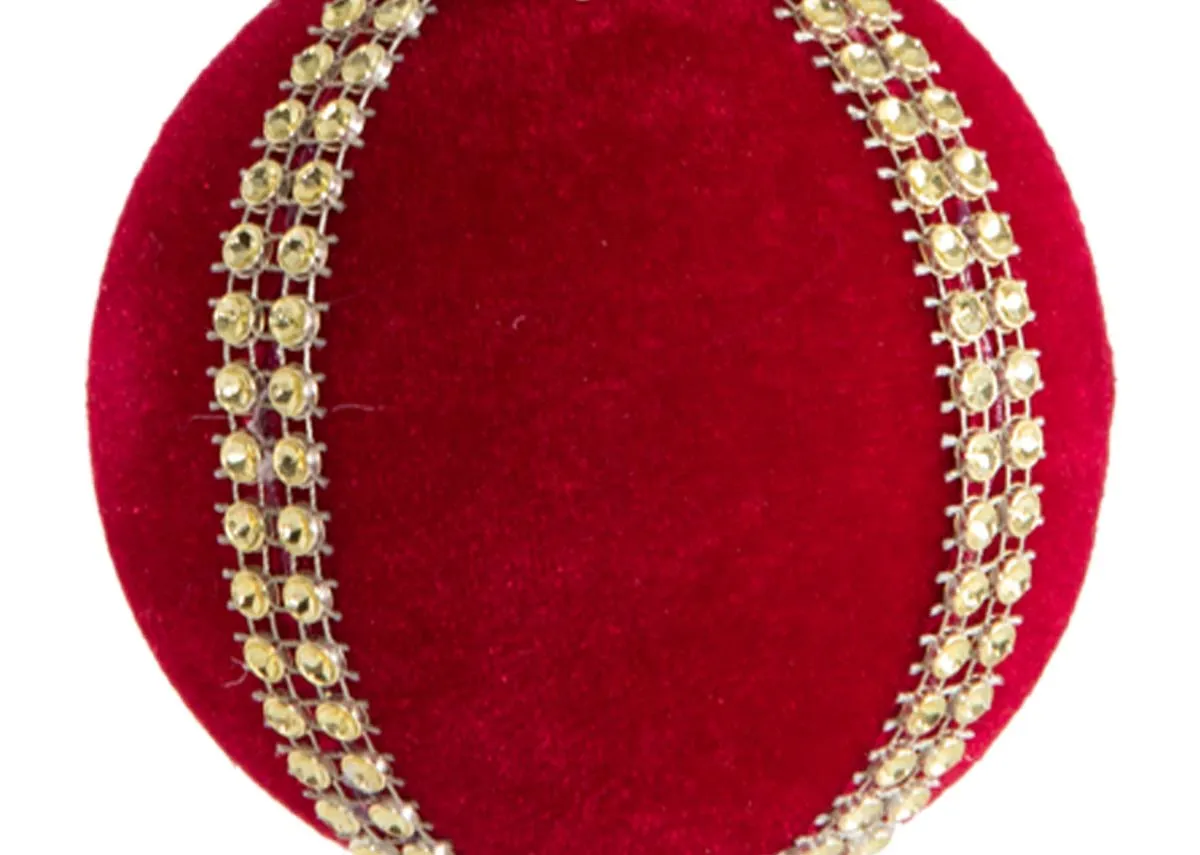 A bright red velvet bauble from EZ Livings Christmas range. Closeup of diamante rows