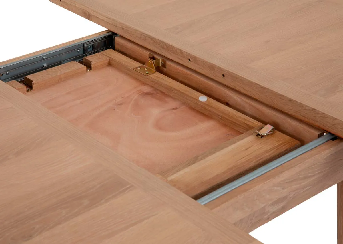 A round oak dining table from EZ Living Furnitures Albany range.Closeup of extension leaf inside table.