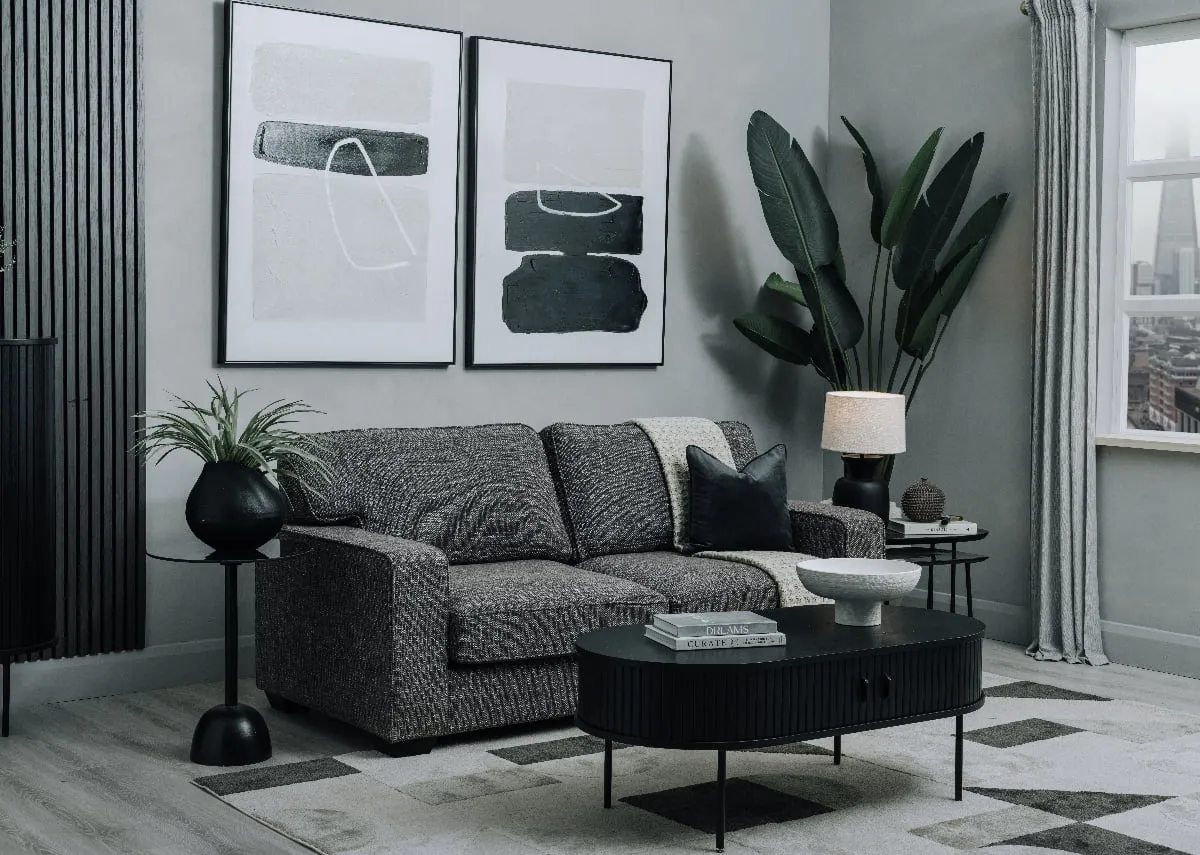 A neveda grey sofabed as a sofa with Nola coffee table and 2 black side tables in a living room