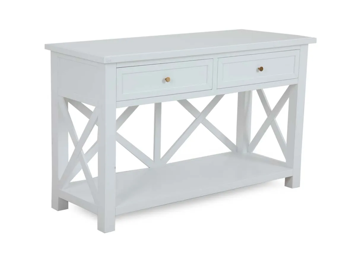 A white console table with 2 drawers from EZ Livings Hampton range. Angled view of framed back with lower shelf.