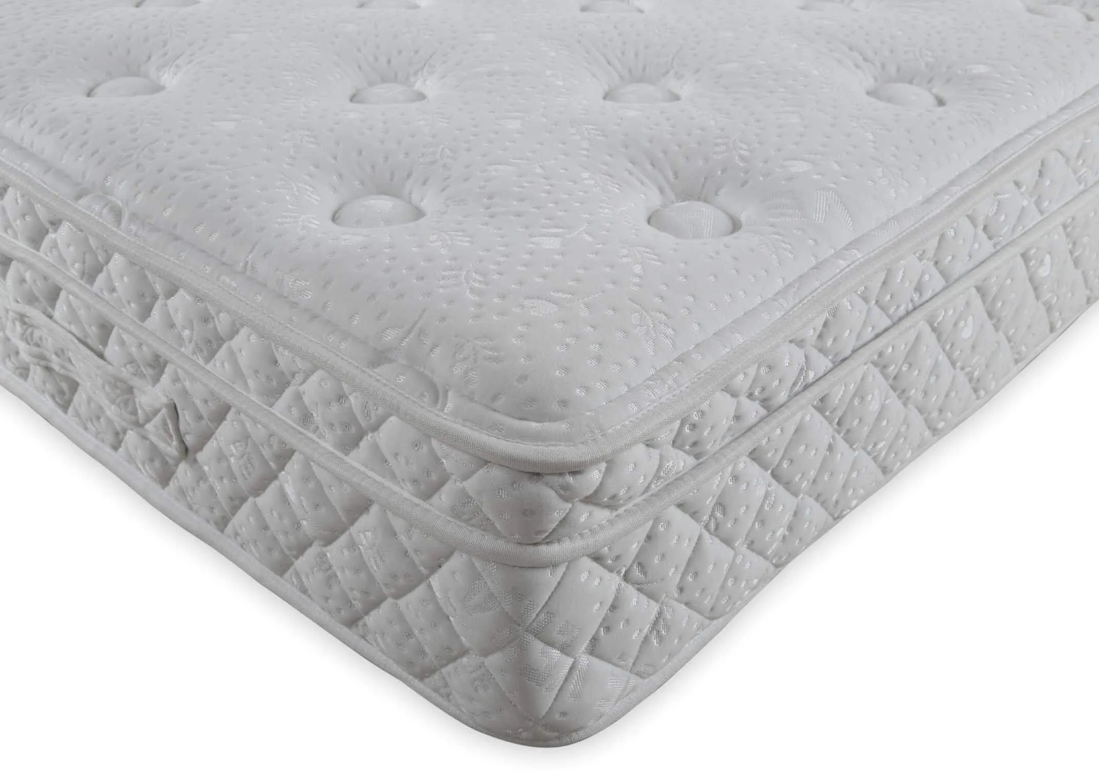 A lifestyle image of the Emilys dream mattress on a Modena bed base with a closeup detail