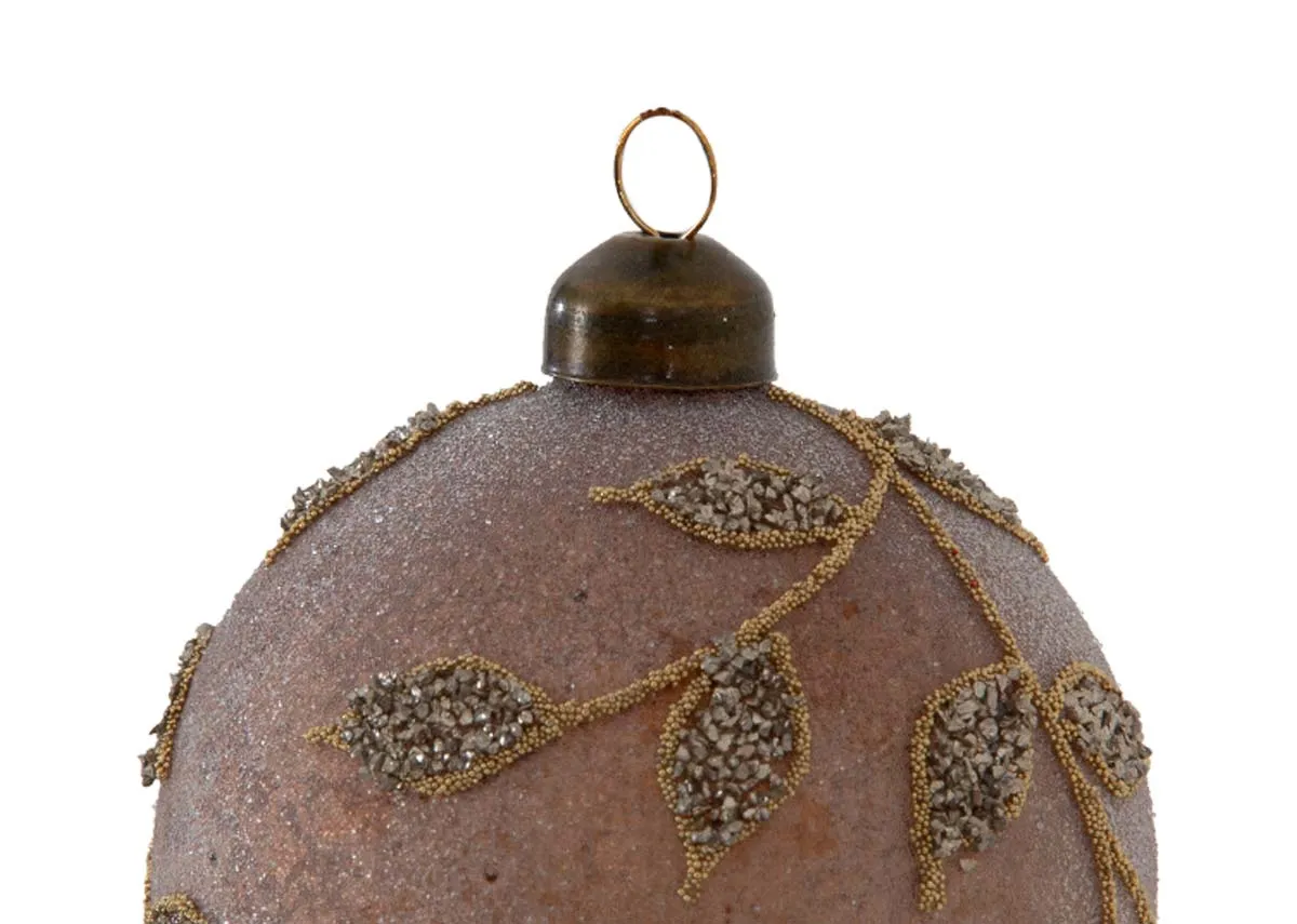 A set of 4 brown baubles with gold leaf pattern from EZ Livings Christmas range.Closeup of vintage brass capo