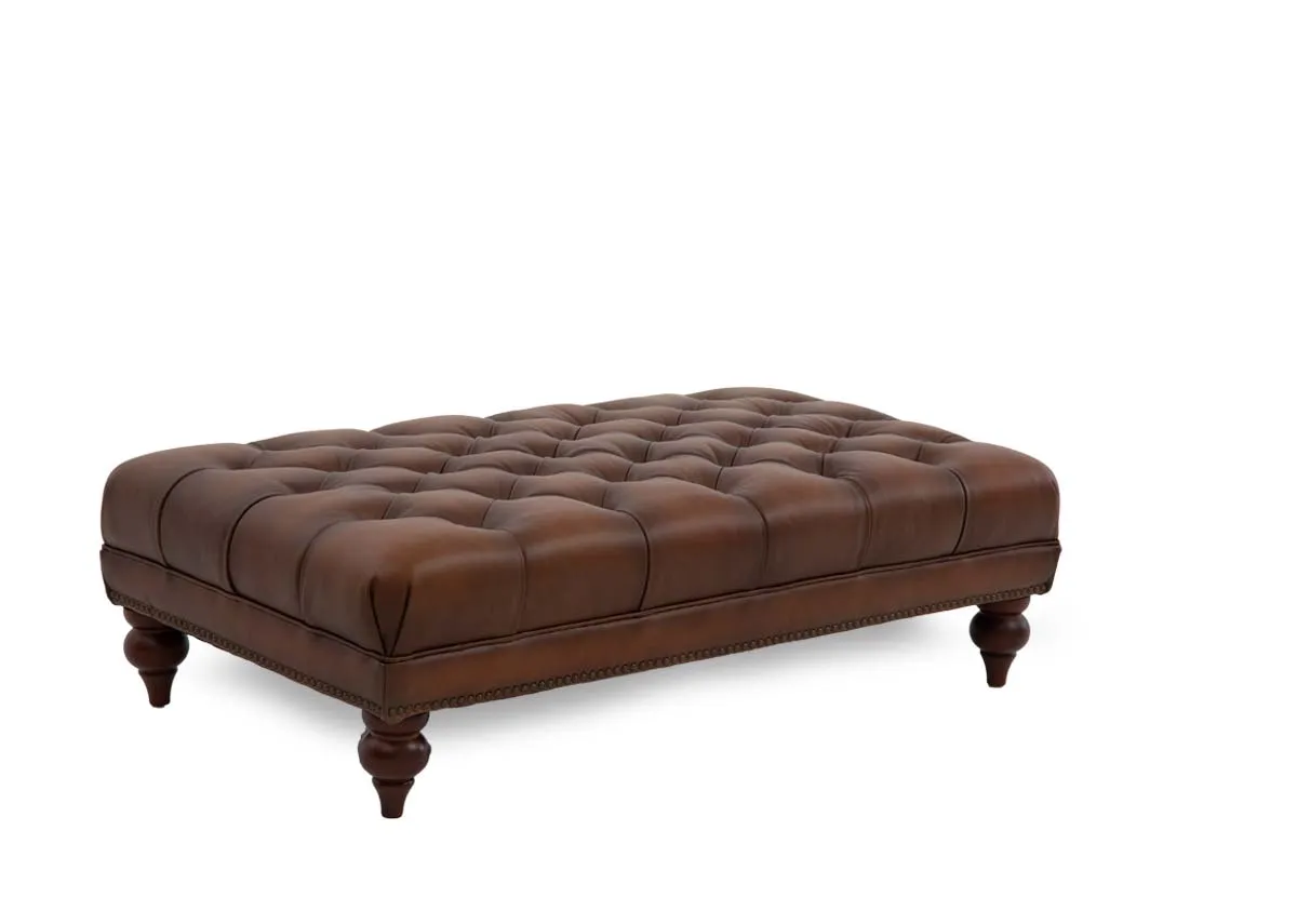 A tufted button brown leather footstool from EZ Livings Adare range. Angled view.