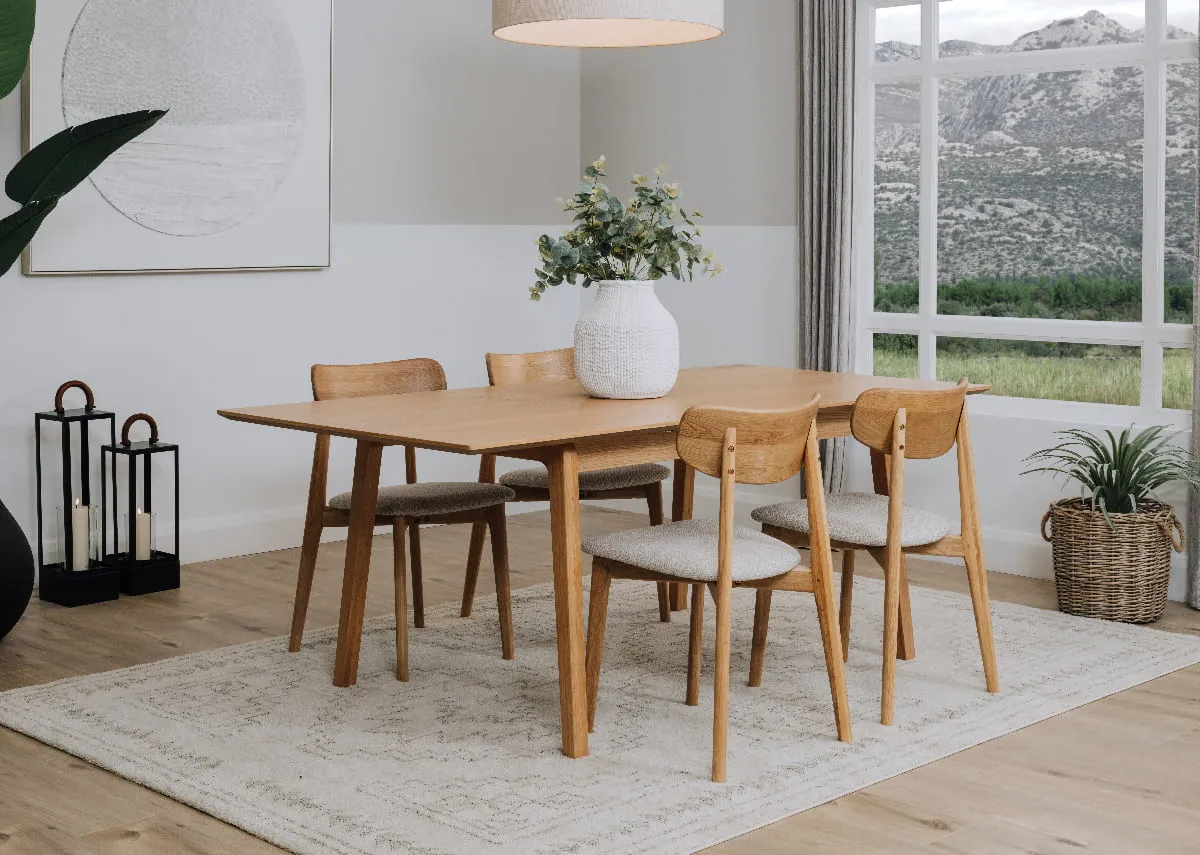 A natural oak dining table from EZ Livings Bari range. Front view of table fixed