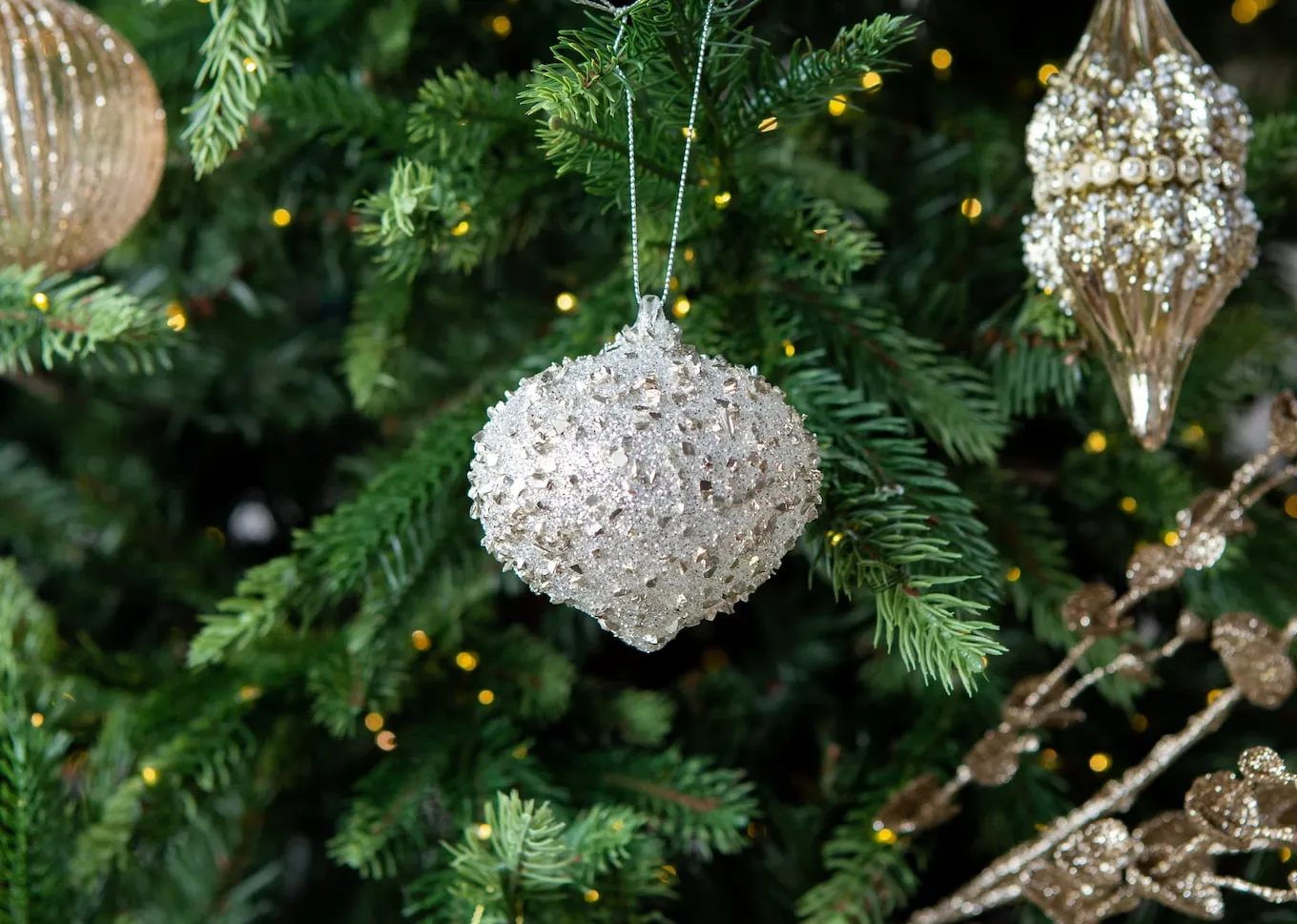 A dimension image of the Have yourself Bauble range on a Christmas tree