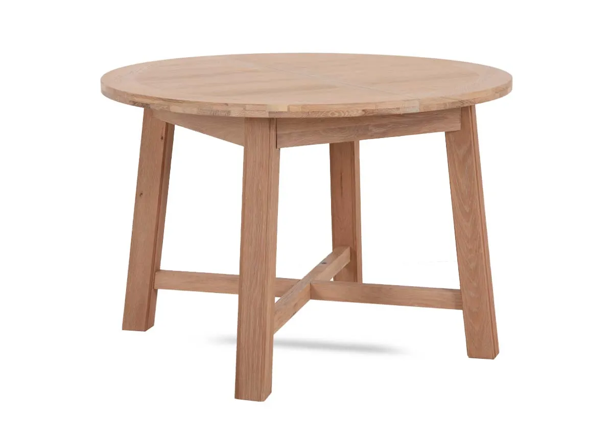 A round oak dining table from EZ Living Furnitures Albany range. Angled view of light oak table