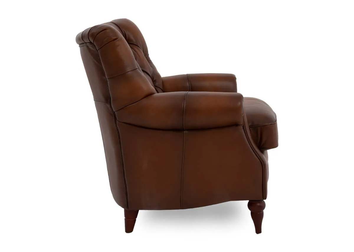 A brown leather accent chair from EZ Livings Hudson range.Side view of padded armrests