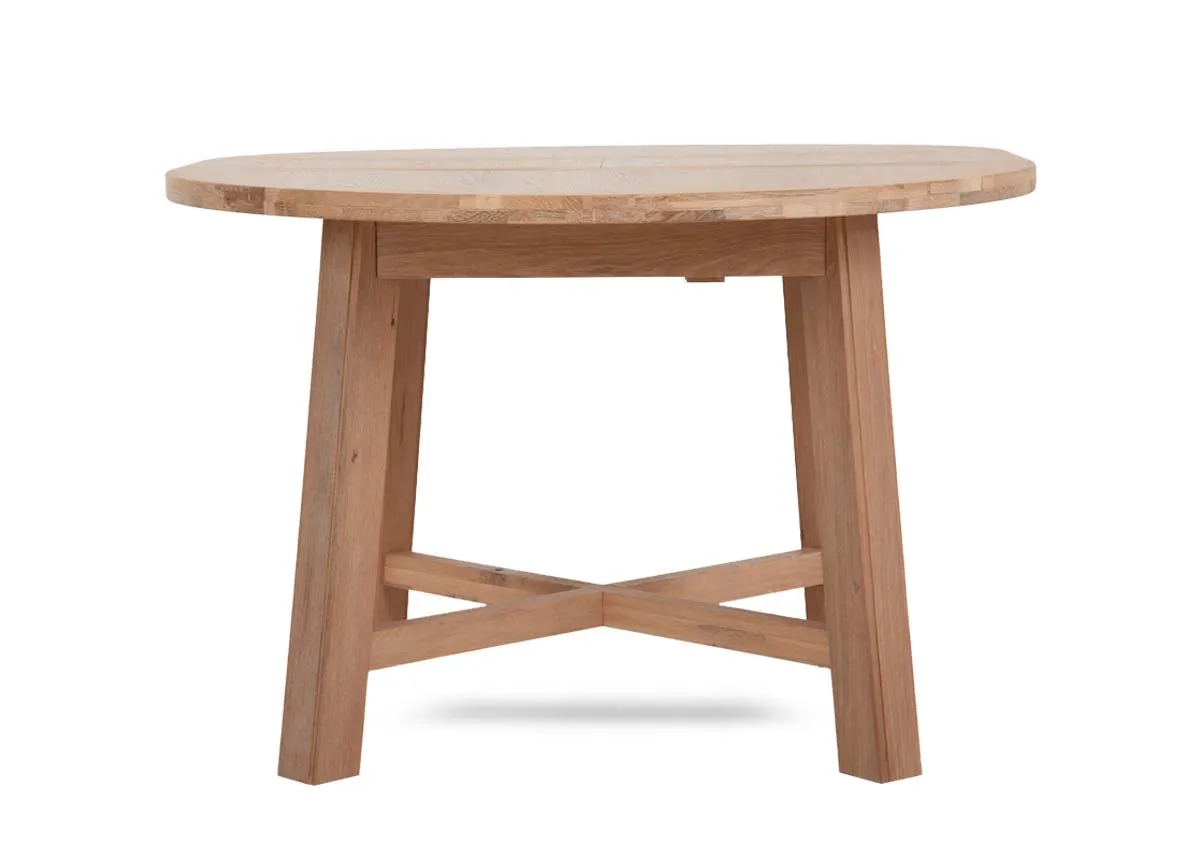 A round oak dining table from EZ Living Furnitures Albany range.Front view of table as fixed round option.