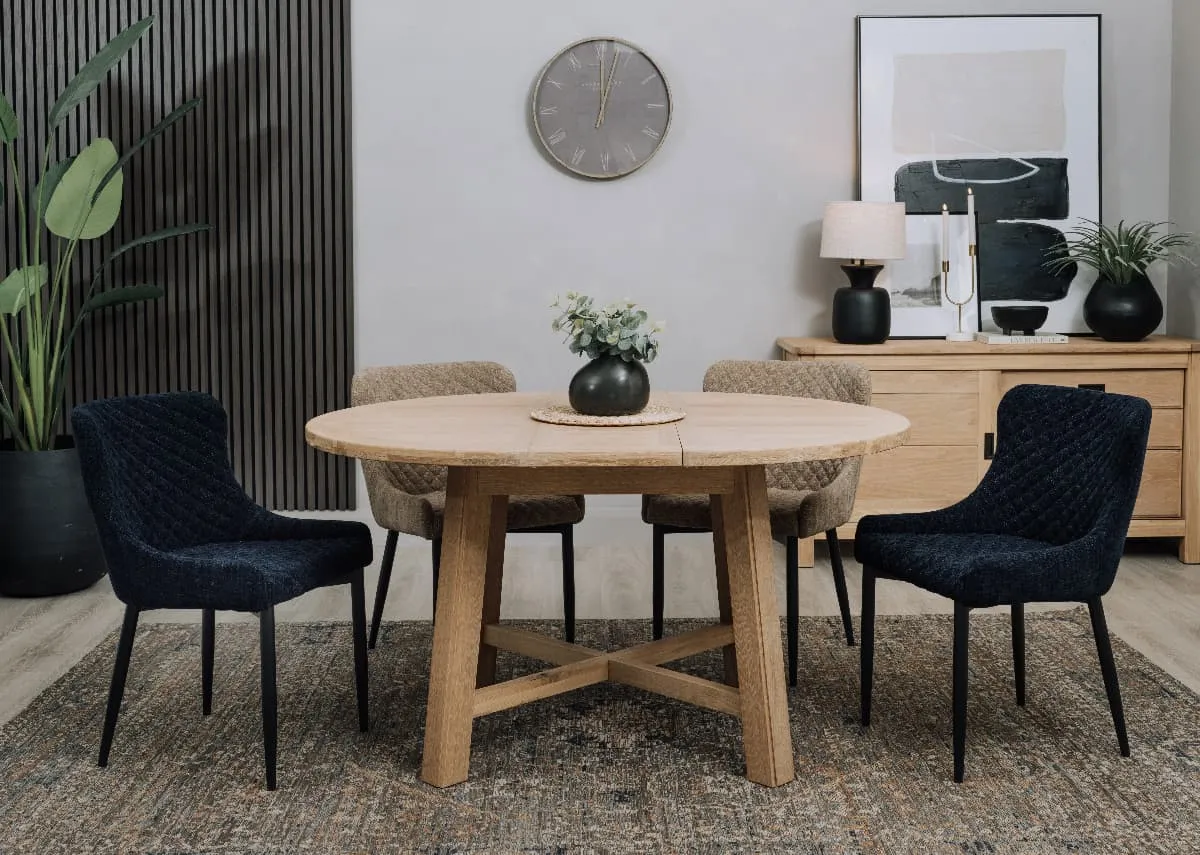 A lifestyle image of the Albany dining table with Dylan chairs in navy and grey.