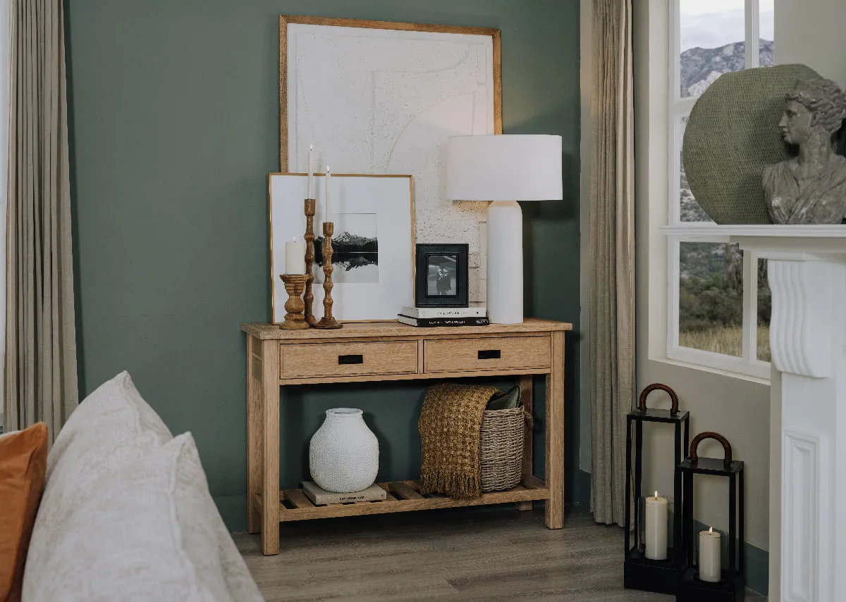 A lifestyle image of Console Table with lanterns.