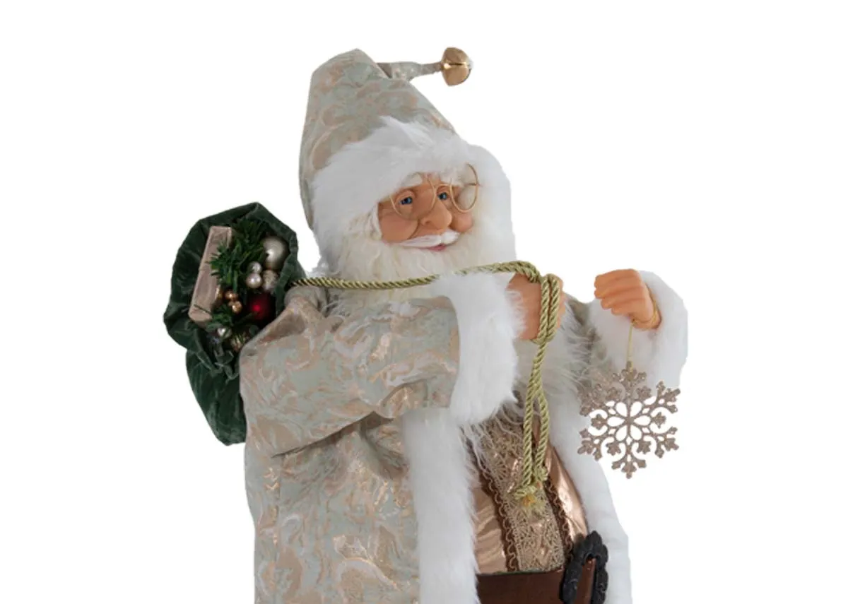 A white & green santa figurine from EZ Livings Papa Noel range. Closeup of santa with cream hat and green sack of presents