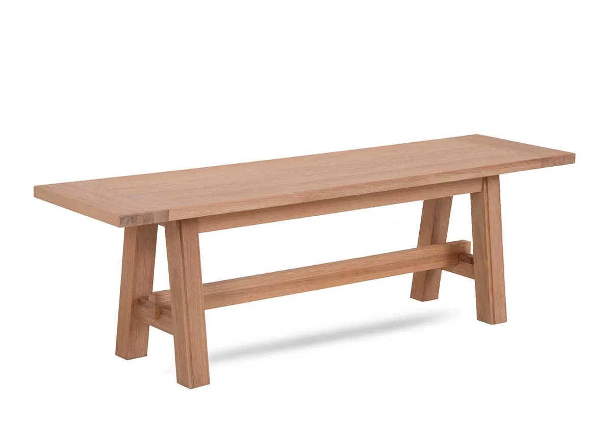 An oak dining bench from EZ Livings Albany range. Angled view of the clean light oak finish.