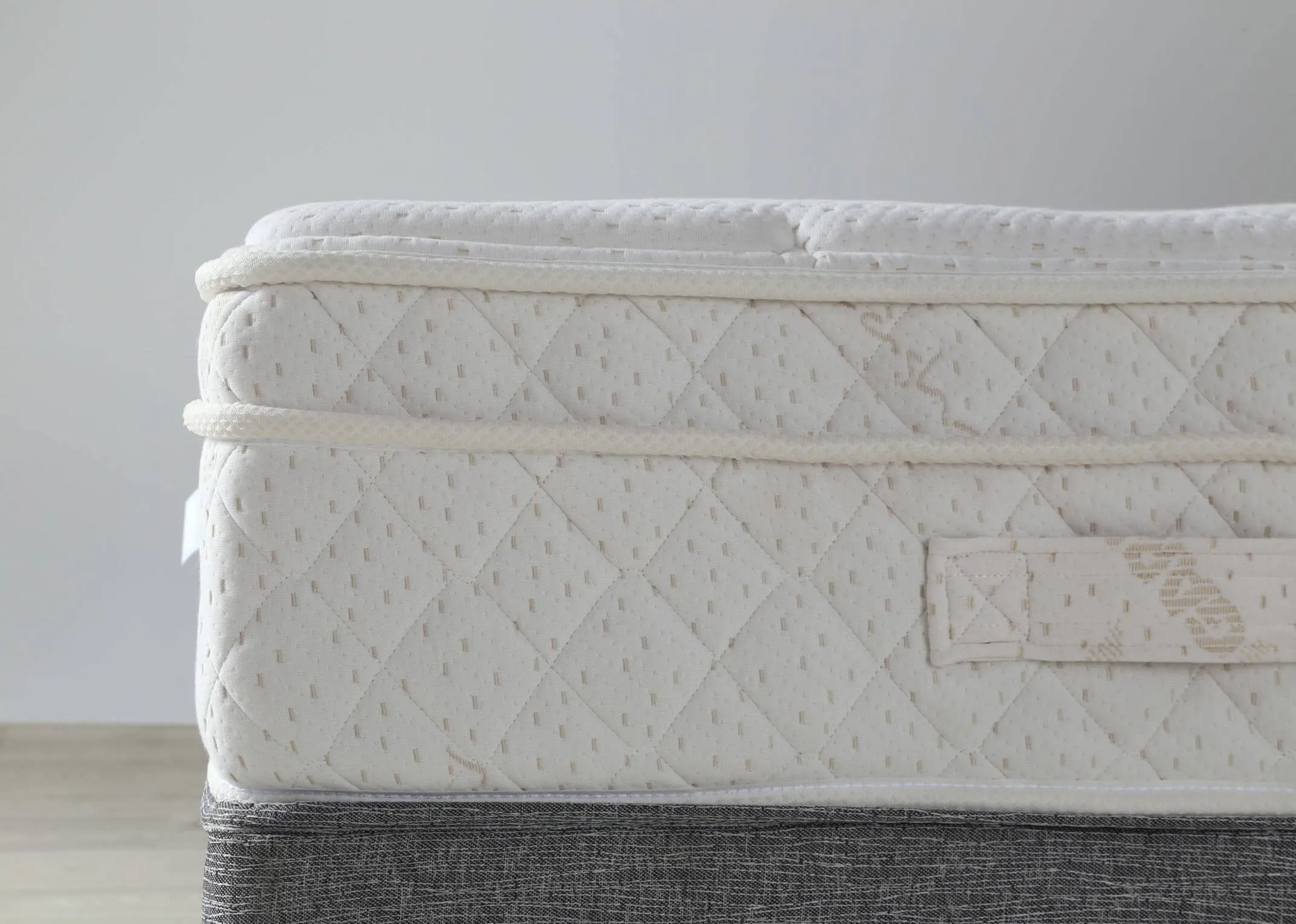 A lifestyle image of the Majesty Cashmere  4 foot 6 mattress on a bed frame with duvet.