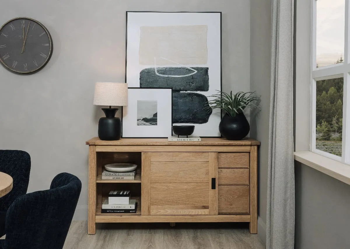 A lifestyle image of the Albany sideboard open showing shelves for dishes and Mode Canvas on top.