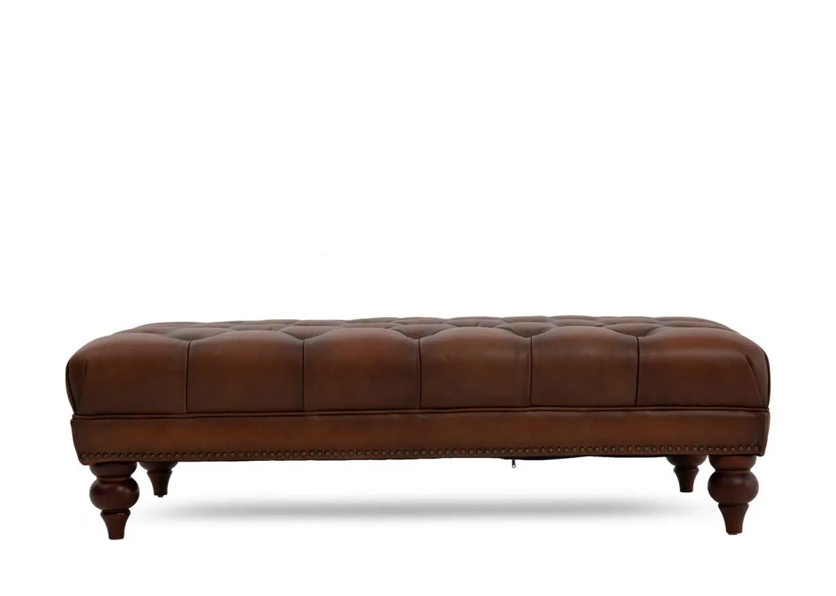 A tufted button brown leather footstool from EZ Livings Adare range. Front view