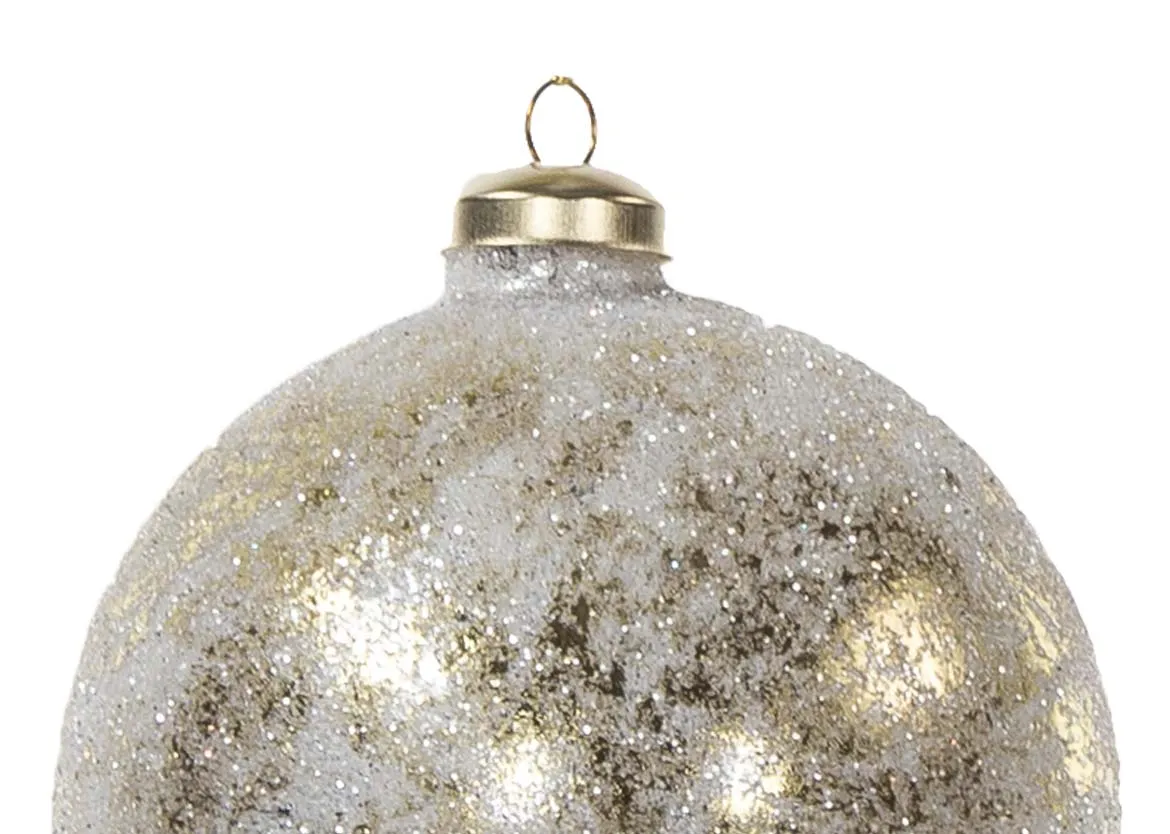A distressed gold bauble with faded patches from EZ Living Furniture's Christmas collection. Closeup of sparkle.