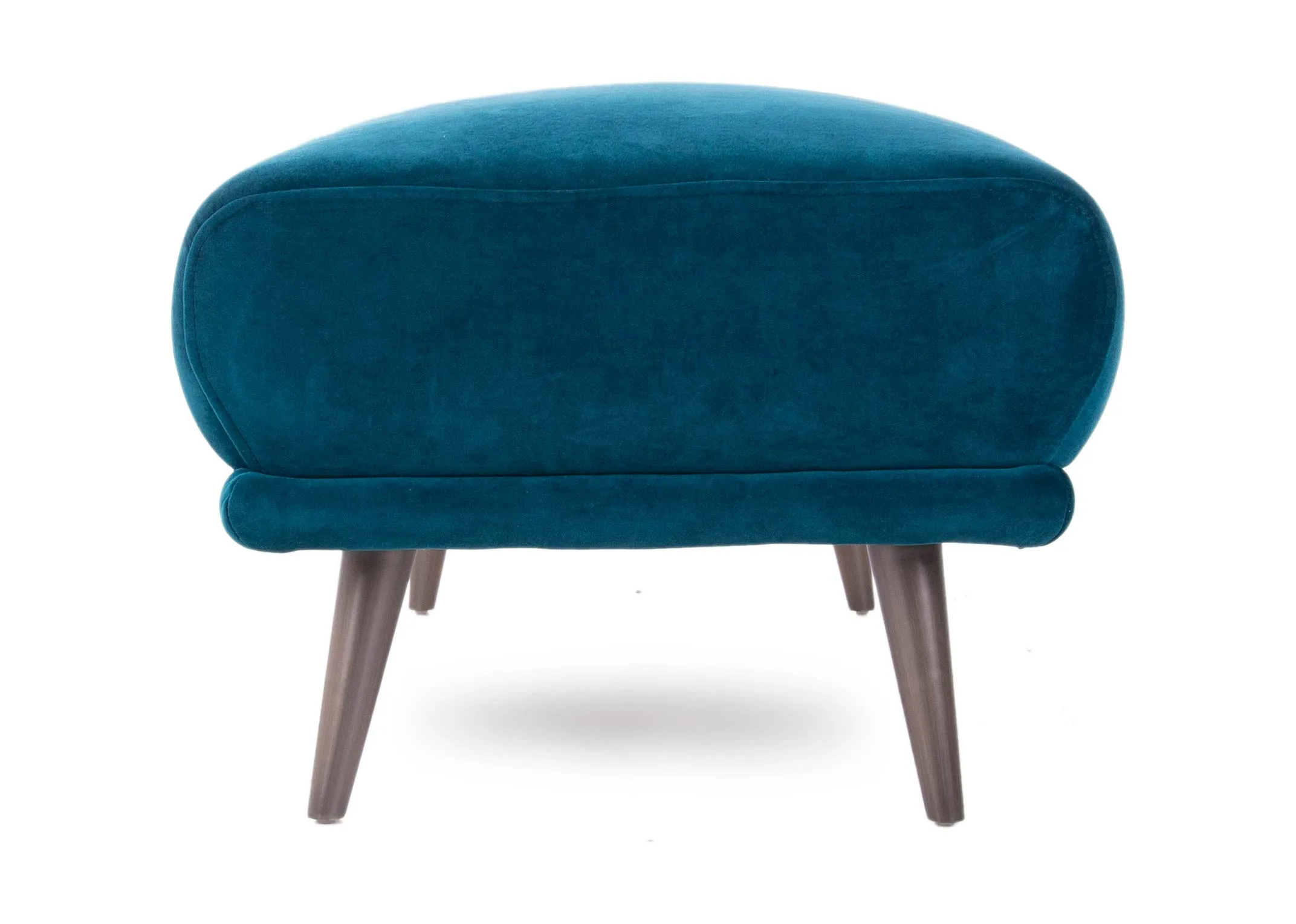 A teal velvet large footstool with wood legs from EZ Living Furniture's Katie range. Side view of thick cushioned footstool