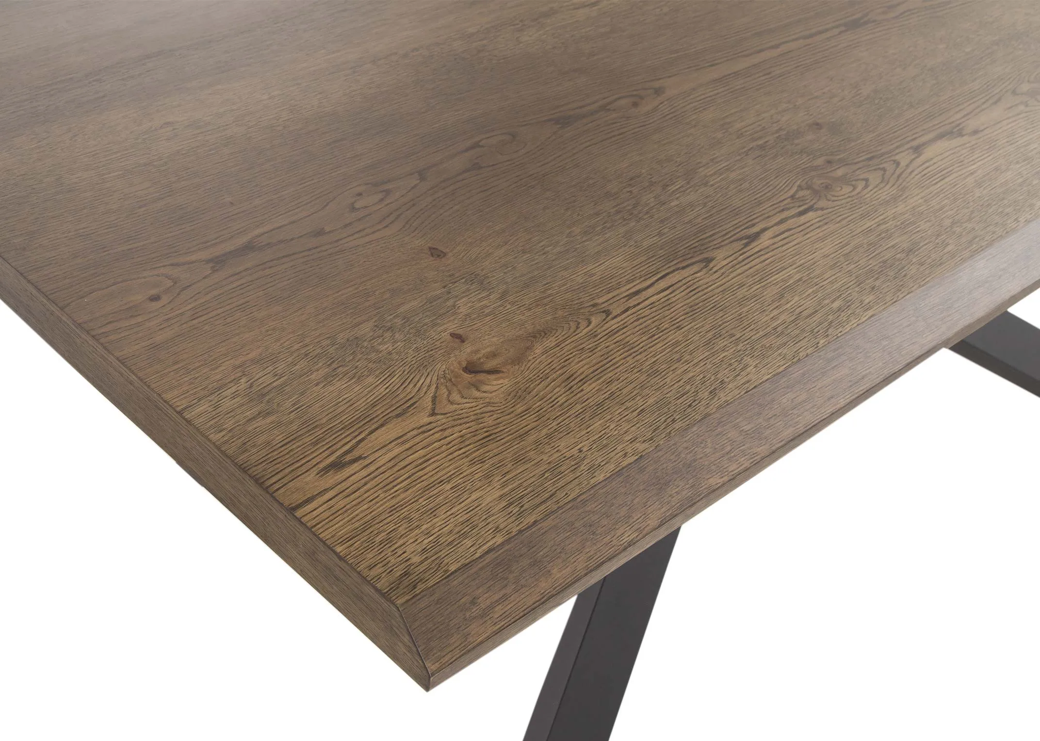 A smoked oak dining table with black x legs from EZ Living Furniture's Arno Range. Closeup of wood finish