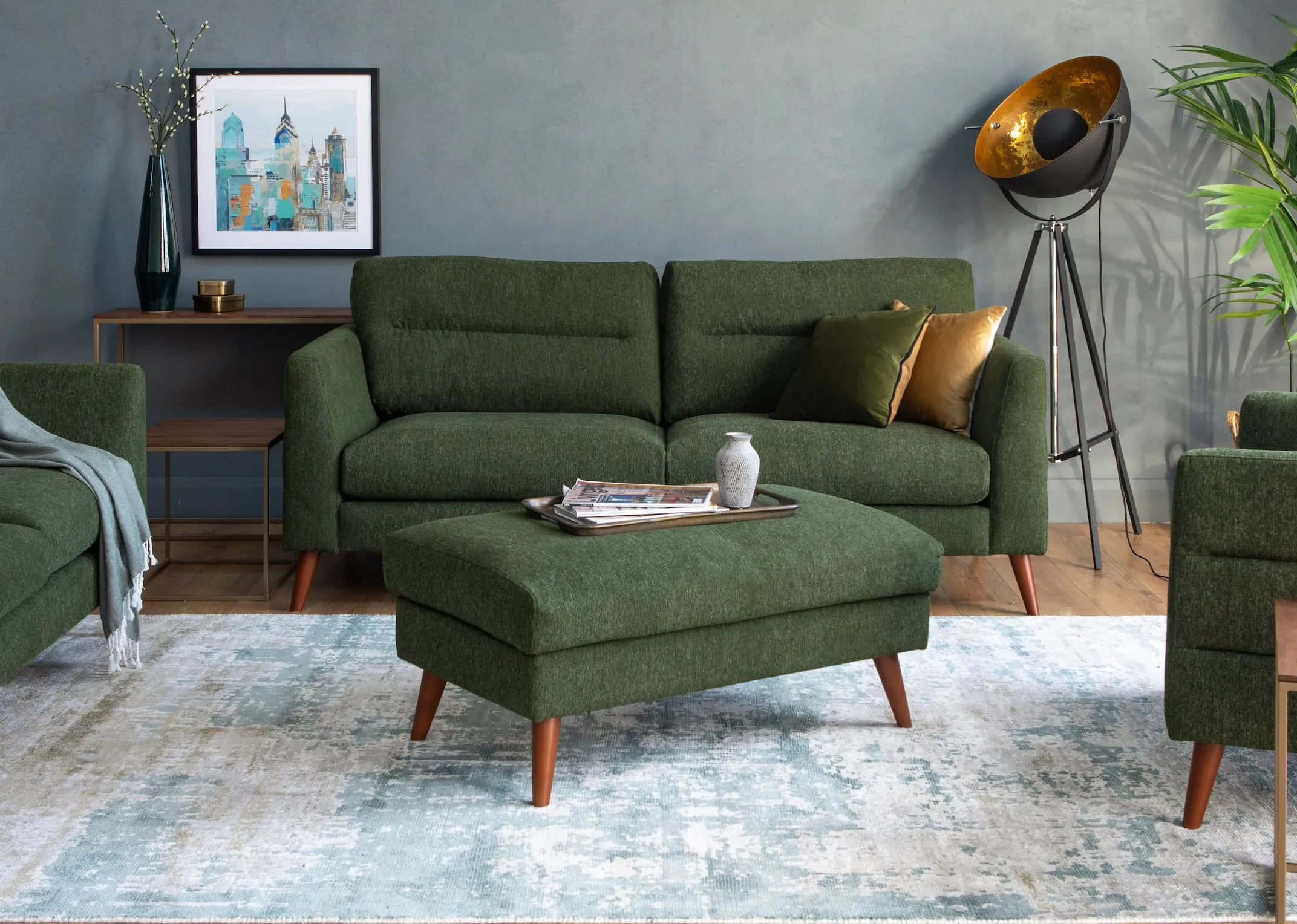 A lifestyle image of the Presley Sofa range with footstool & aston tables