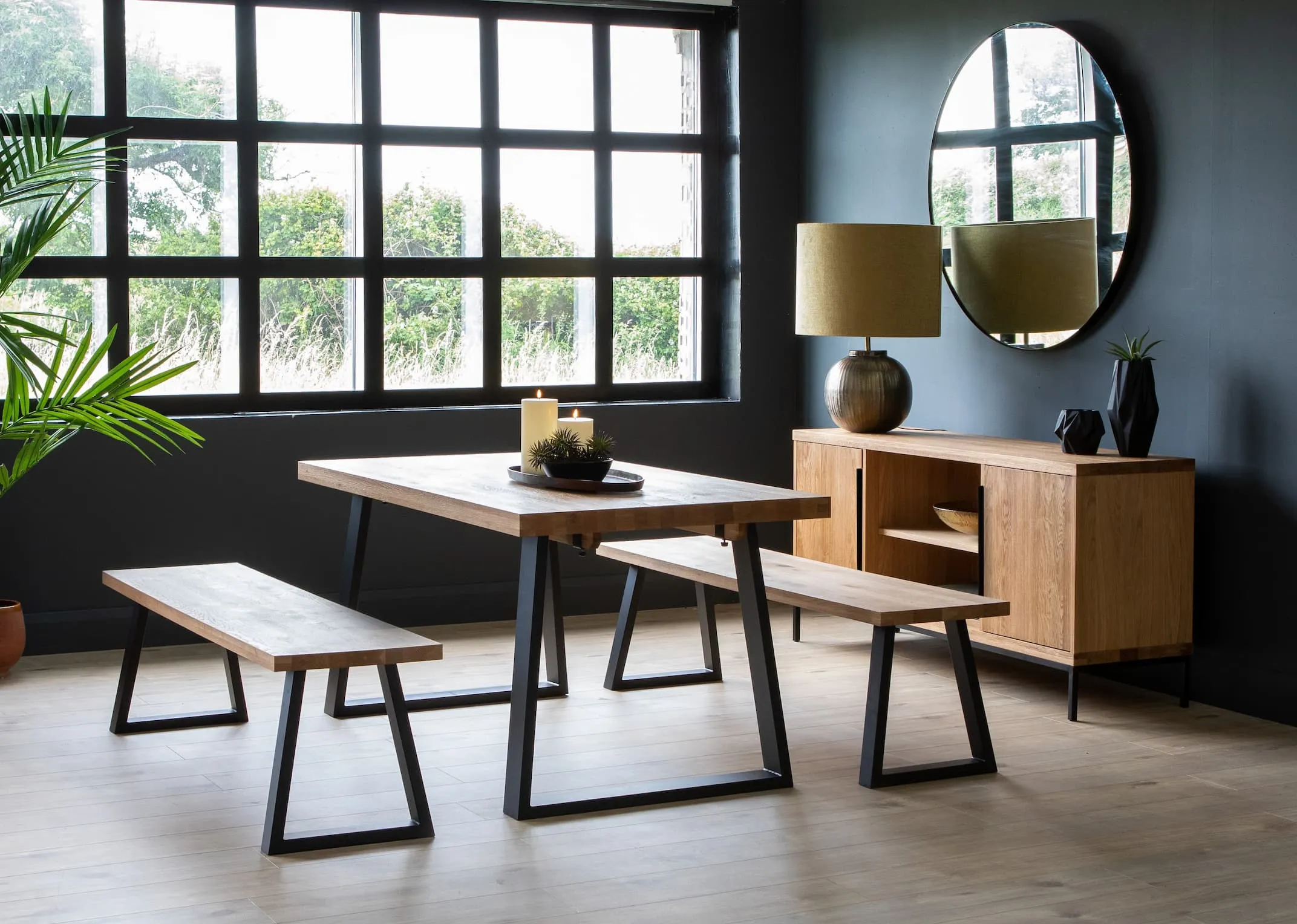 A lifestyle image of the Small dining table with bench & sideboard with bolcho table lamp with elling mirror